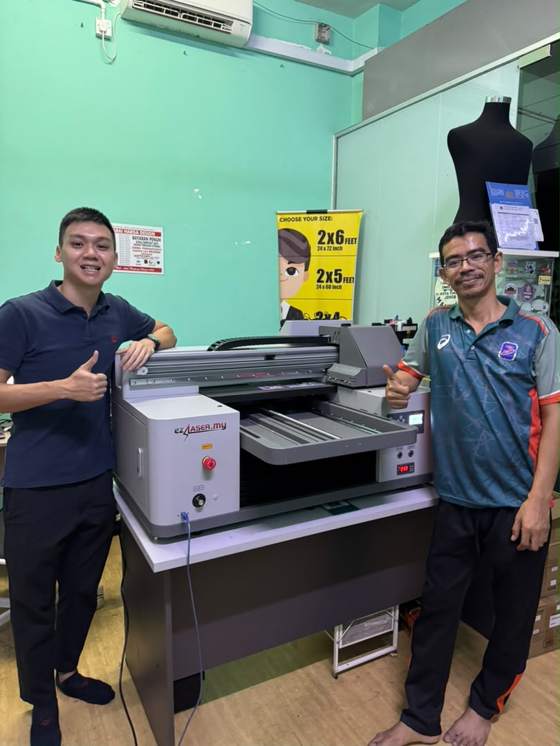 Happy customer standing with their newly delivered UV printer