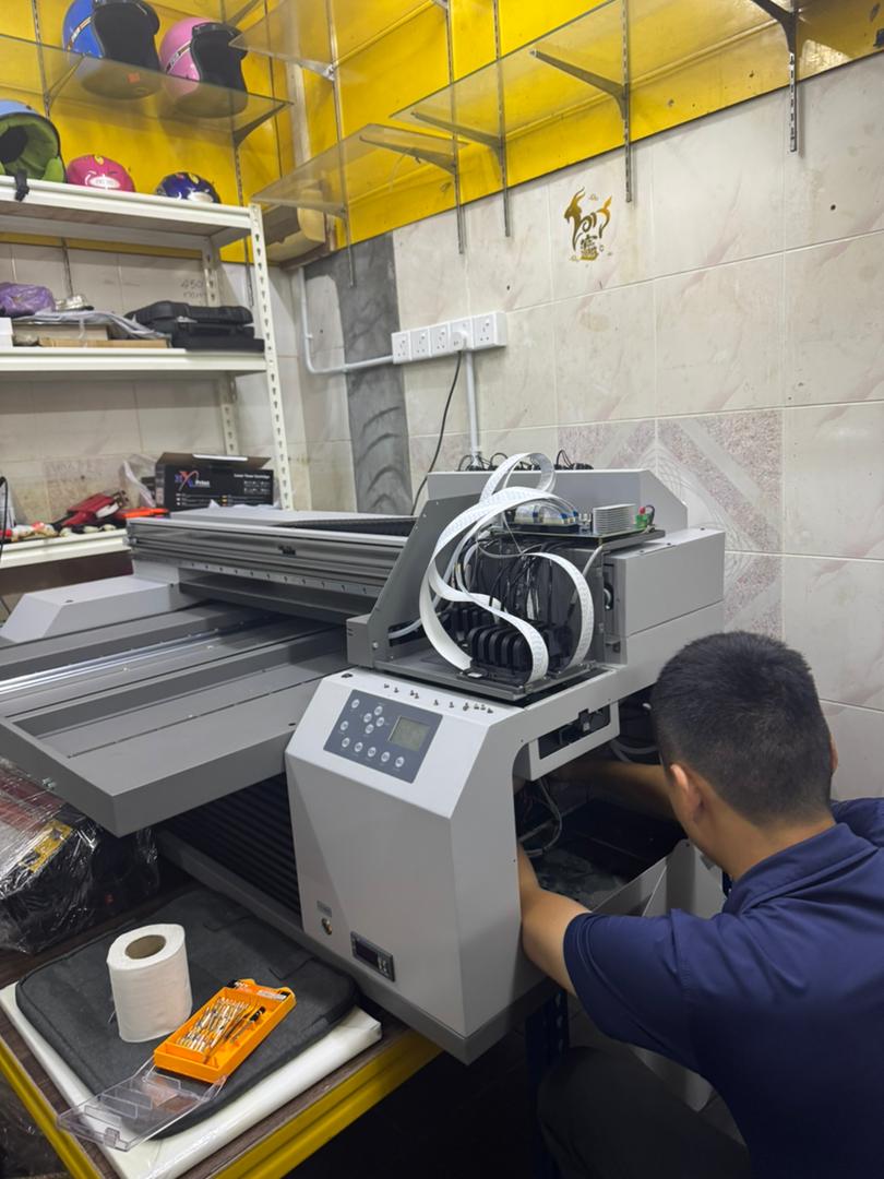 ezLASER.my delivery and setup team with a customer's new printer