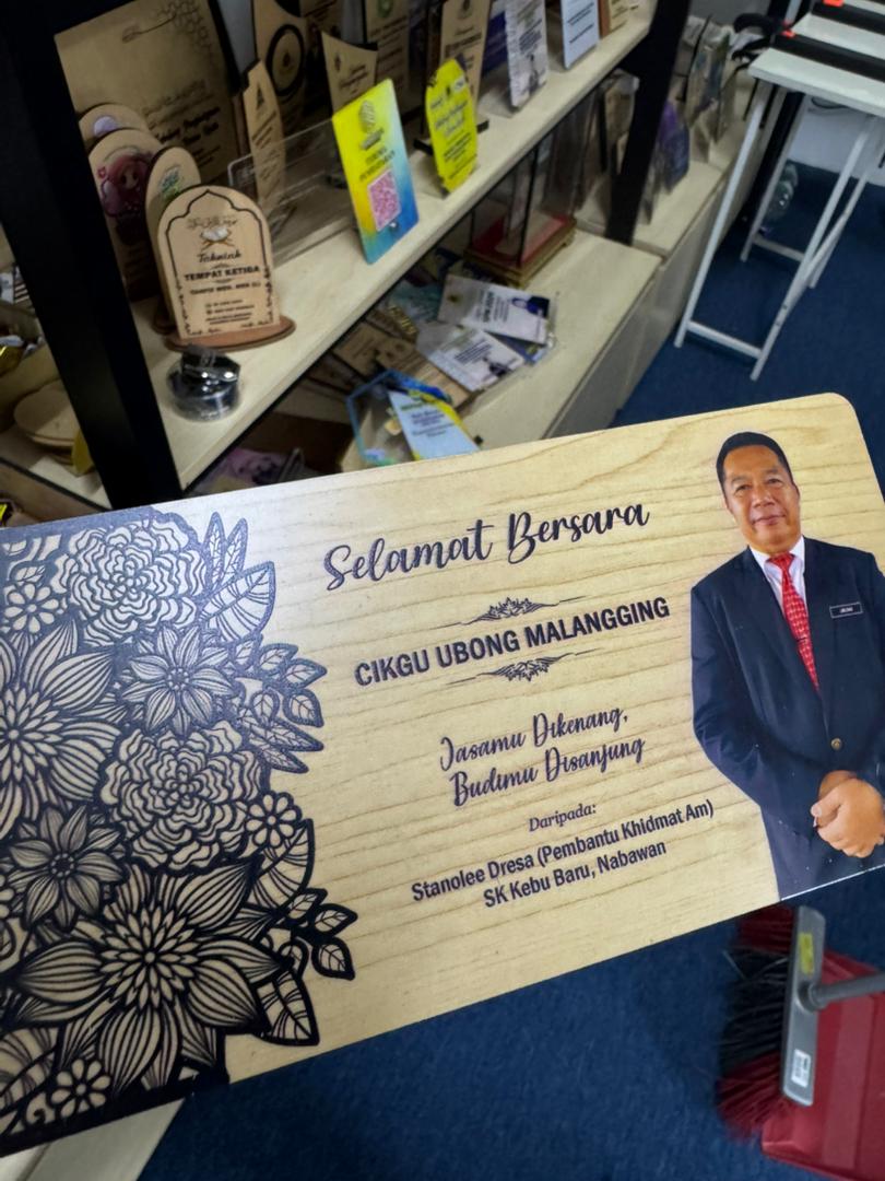 Engraved wooden retirement plaque printed for a school teacher in Sabah